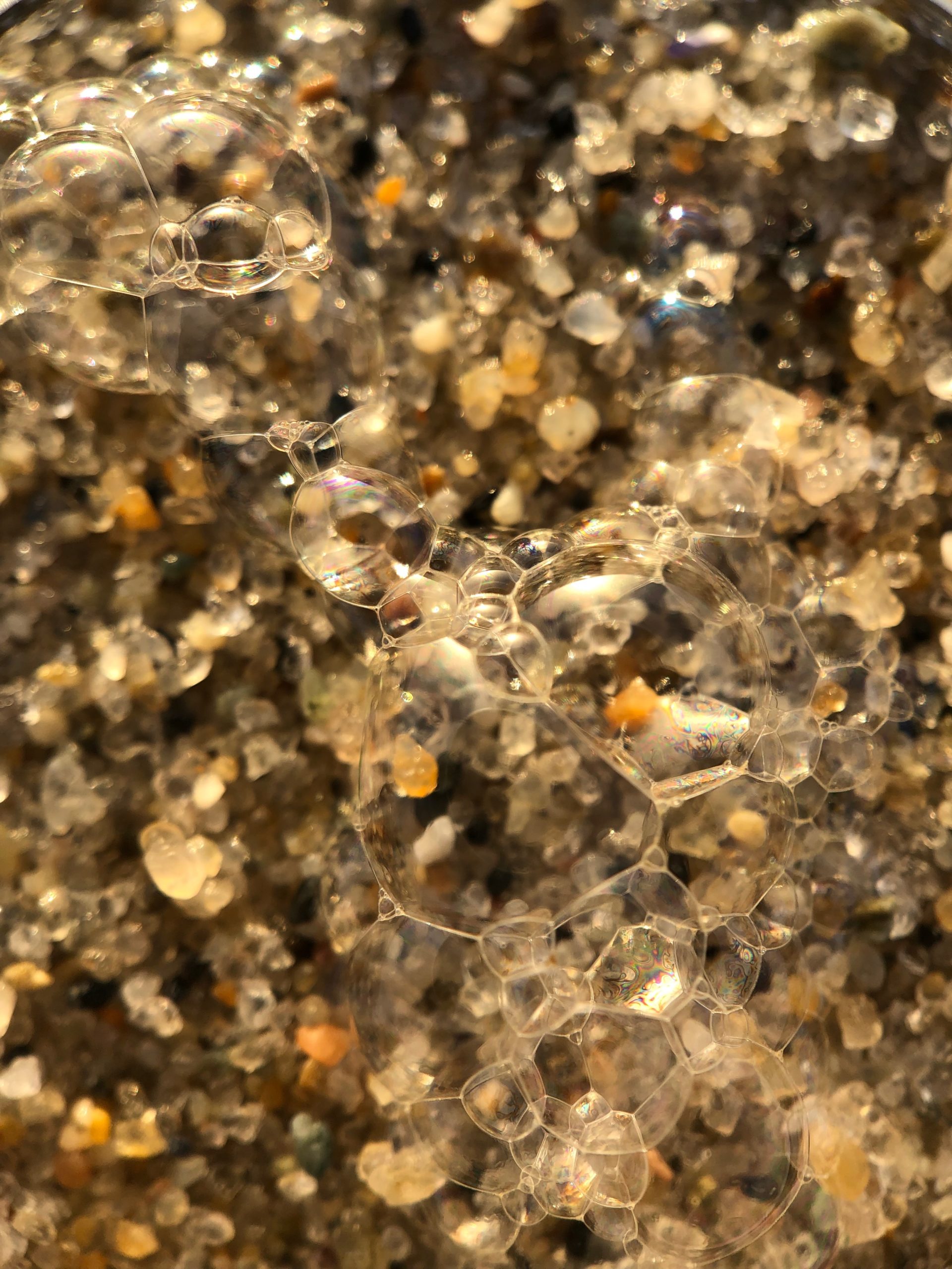 Beach sand with water bubbles